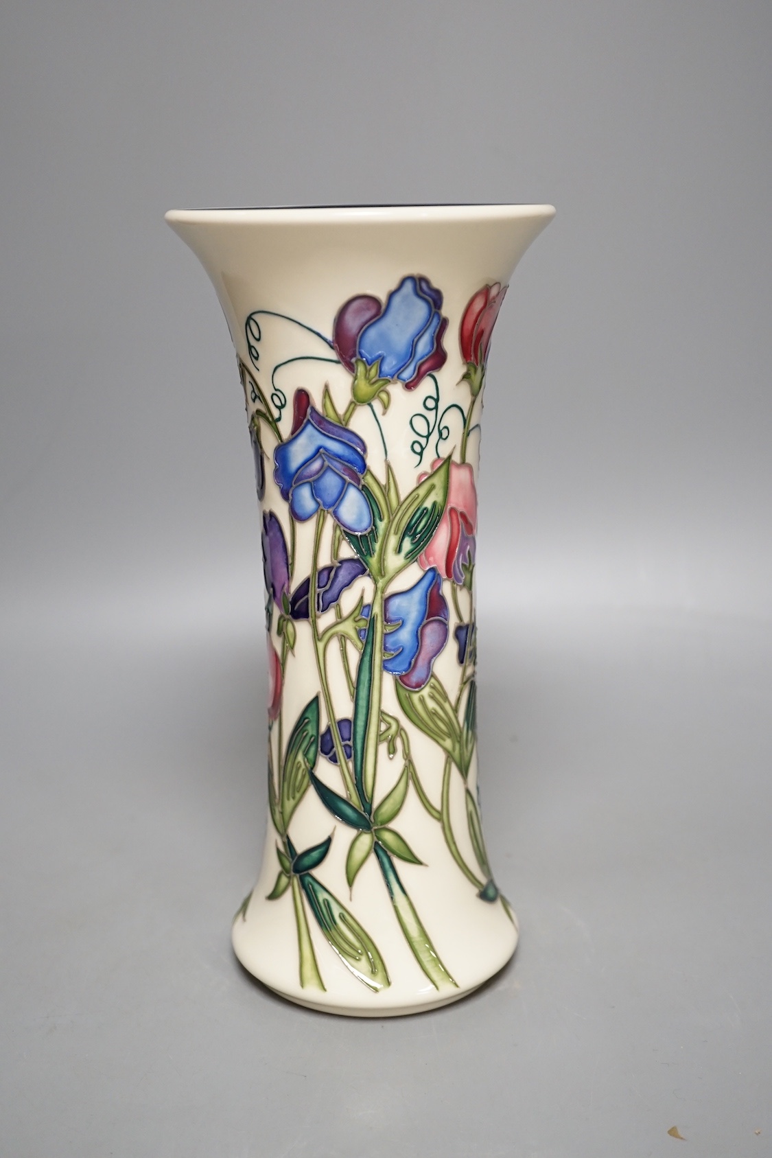 A Moorcroft 'sweetness' vase, boxed, 25 cms high.